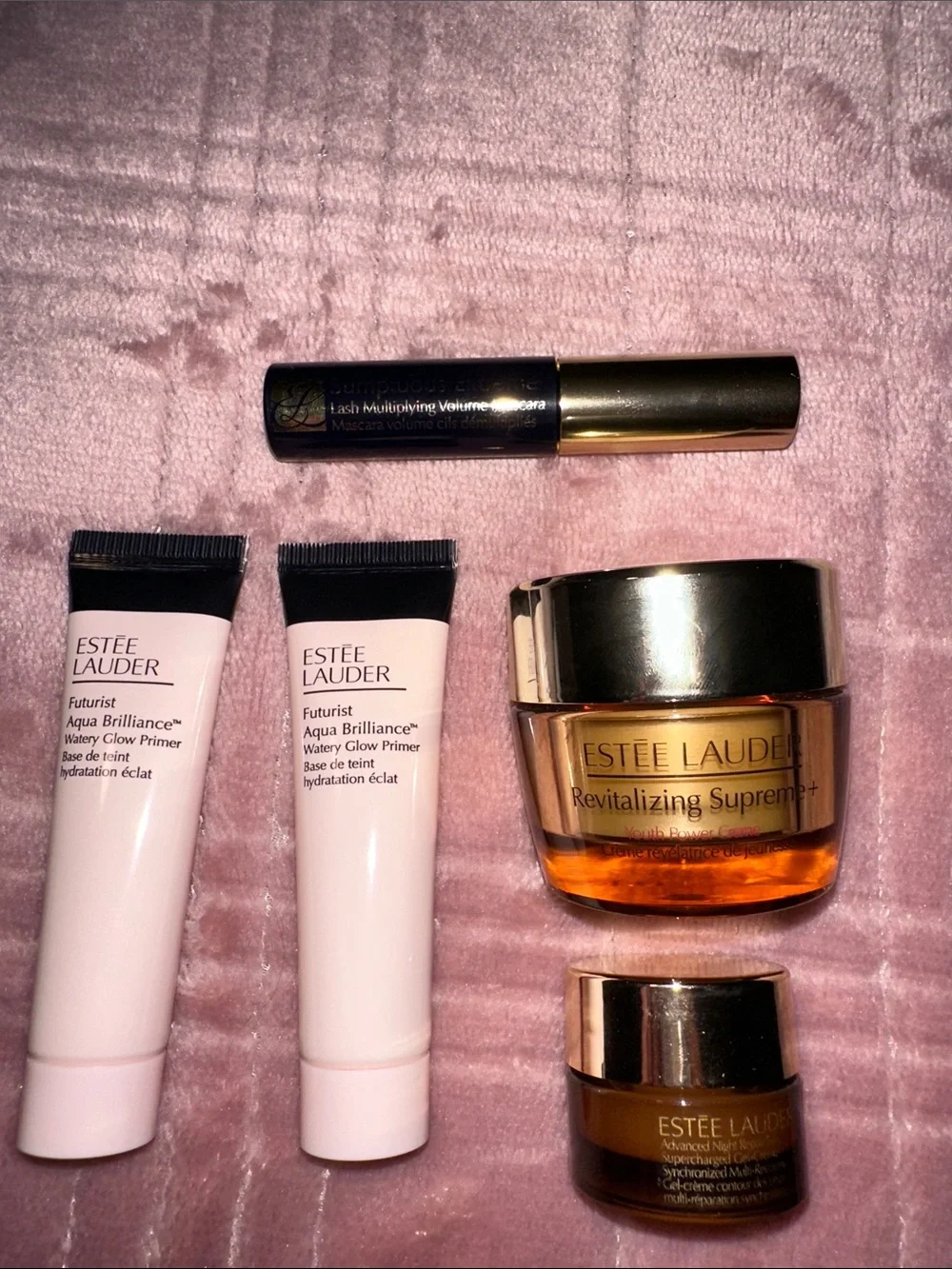 Estee Lauder Skincare Assortment with Blue, Pink, Gold and Brown Accents
